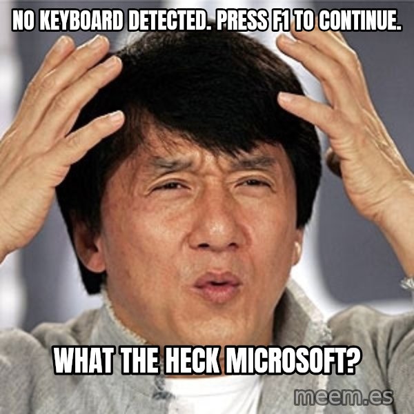 Jackie Chan meme: No keyboard detected. Press f1 to continue. / What the heck Microsoft?