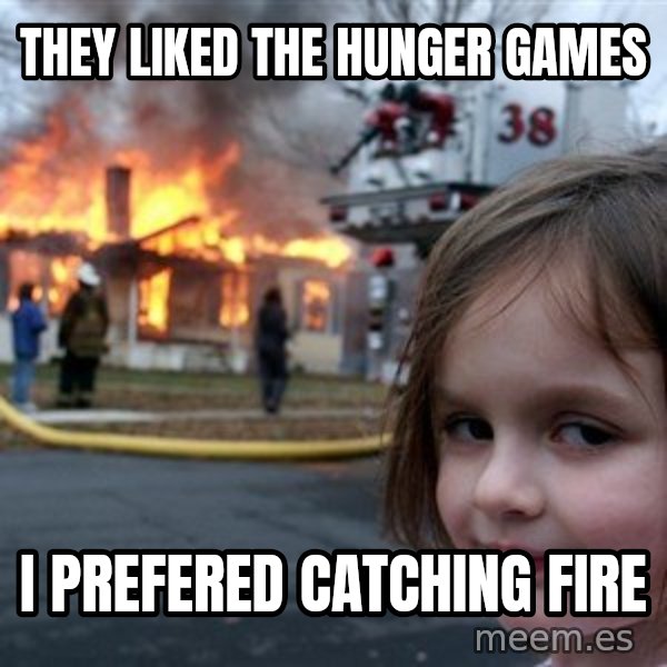 Disaster Girl meme: They liked the hunger games / i prefered catching fire